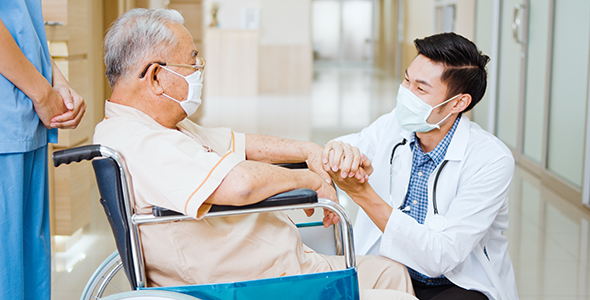 Doctor and patient speaking at the hospital